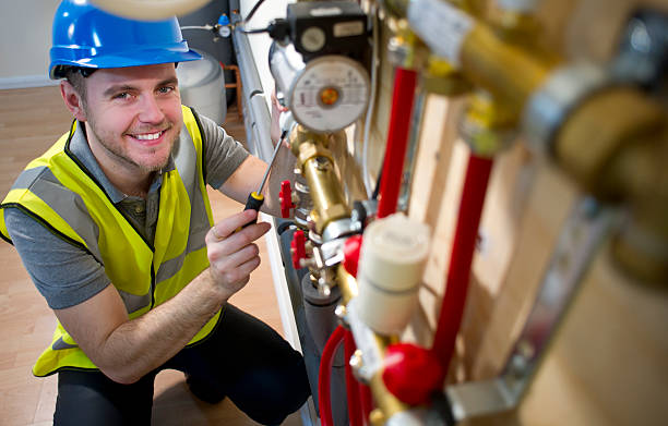 engineer installing underfloor heating system